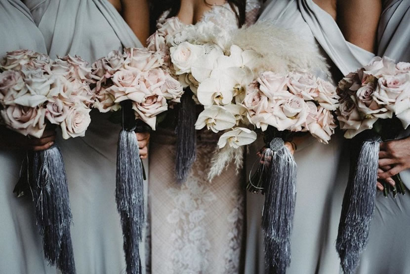 Tassels in bridal entourage's floral bouquets are showstoppers